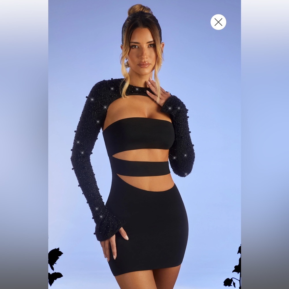 Oh Polly mini black dress. Brand new, never worn. Size 4 in US.